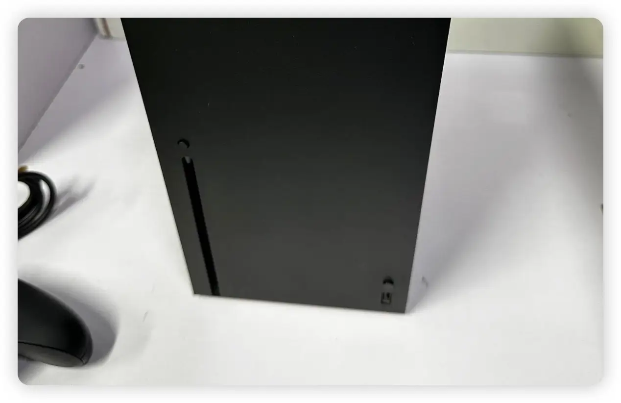 A close-up of an Xbox Series X disc drive, a critical component for pawn evaluation.